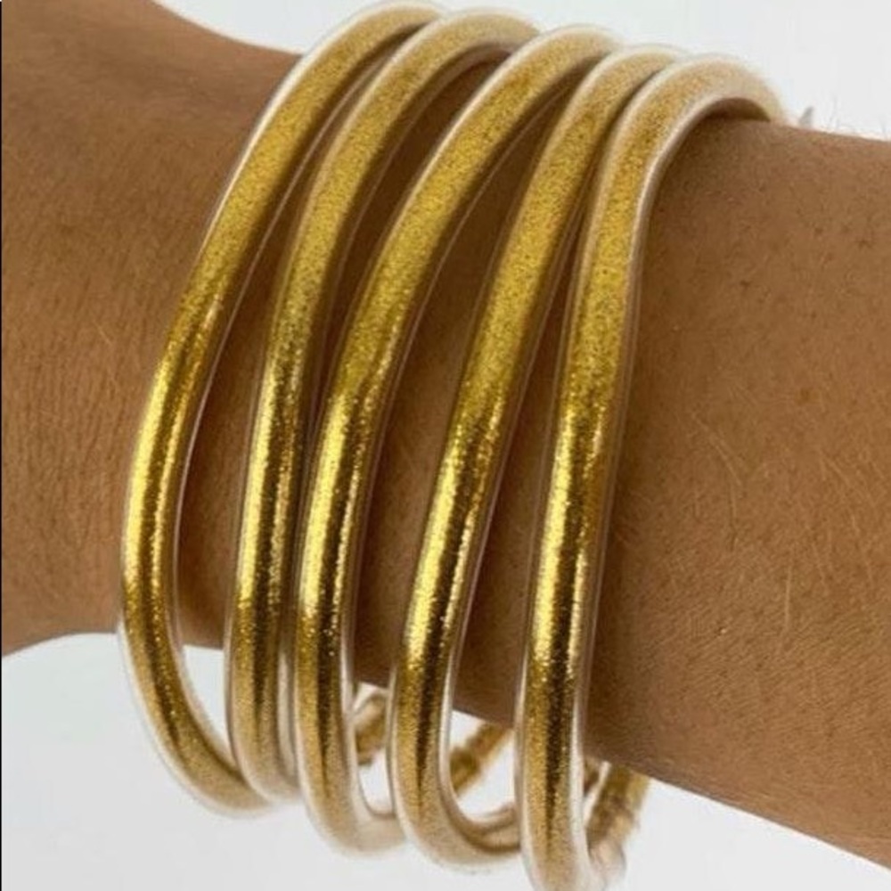 All weather bracelets in gold